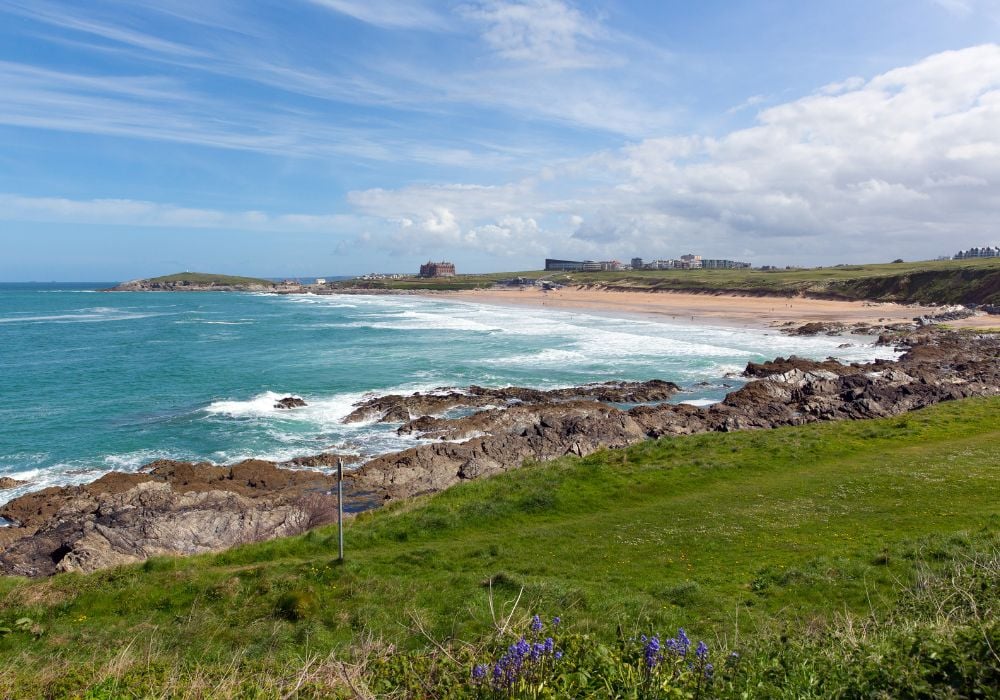 Fristal beach in Newquay, North Cornwall, UK, with blue bells in spring, one of the best coasteering spots in the UK.